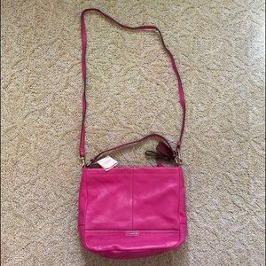 Magenta Coach handbag with crossbody attachment